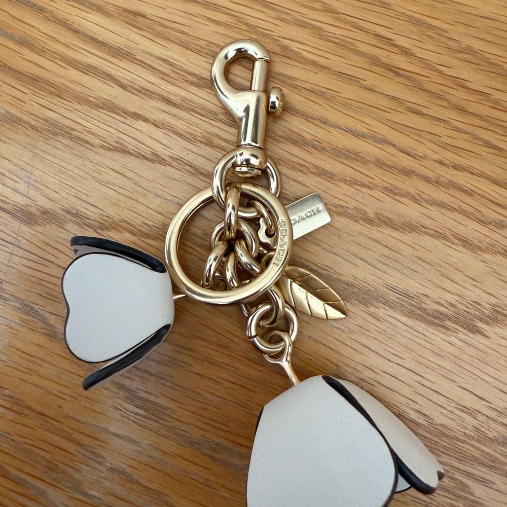 Sold- Coach white tea rose bag charm keychain